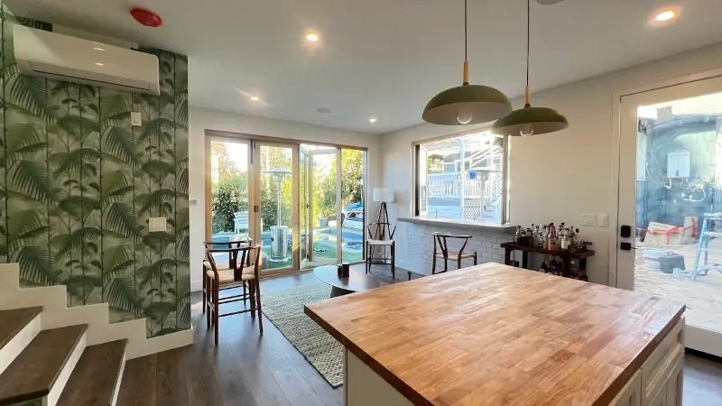 Pasadena pool house ADU — living room with accordion patio door