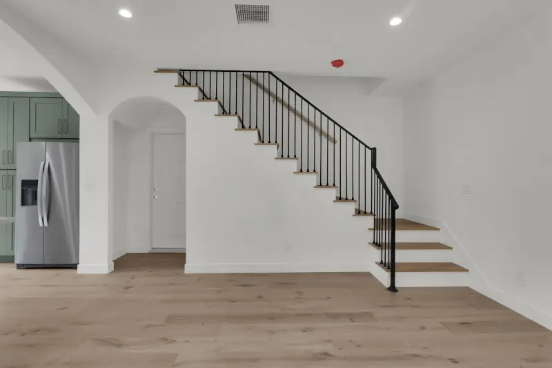 2-story ADU — wrought iron staircase