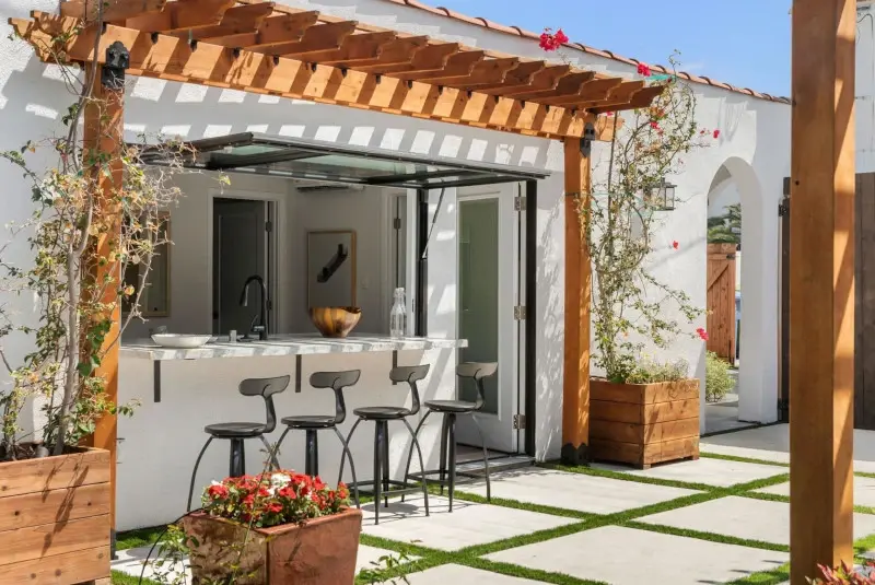 Spanish bungalow garage conversion — breezeway connecting to main house