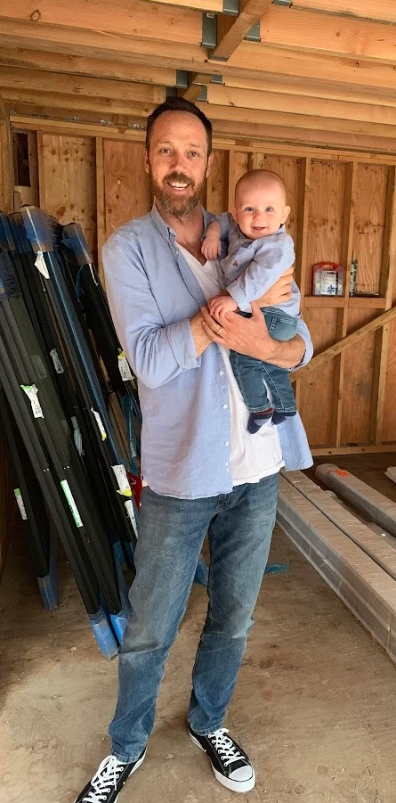 Charlie, founder of CALI ADU, with his son on an ADU construction site in Los Angeles