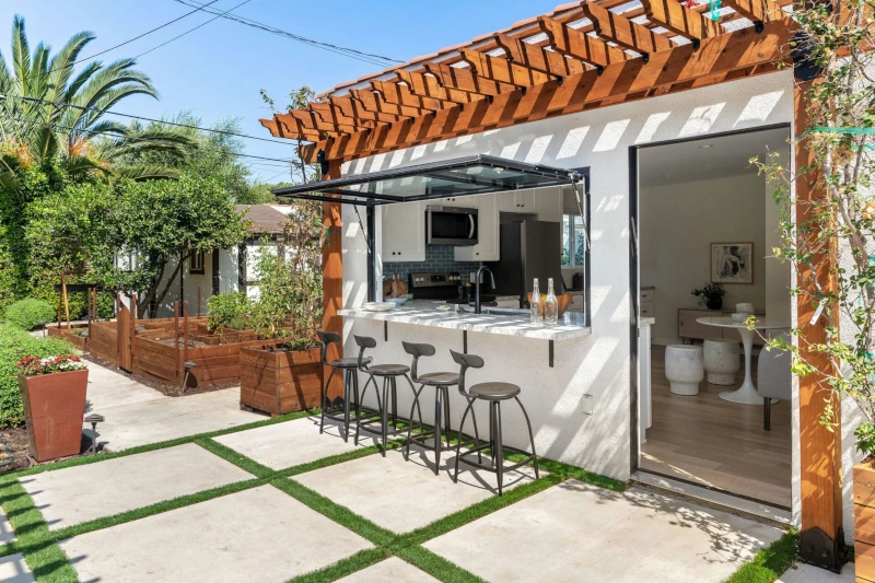 Trellis blocks daytime sun on windows on this ADU in Los Angeles