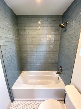Bathtub with subway tile surround