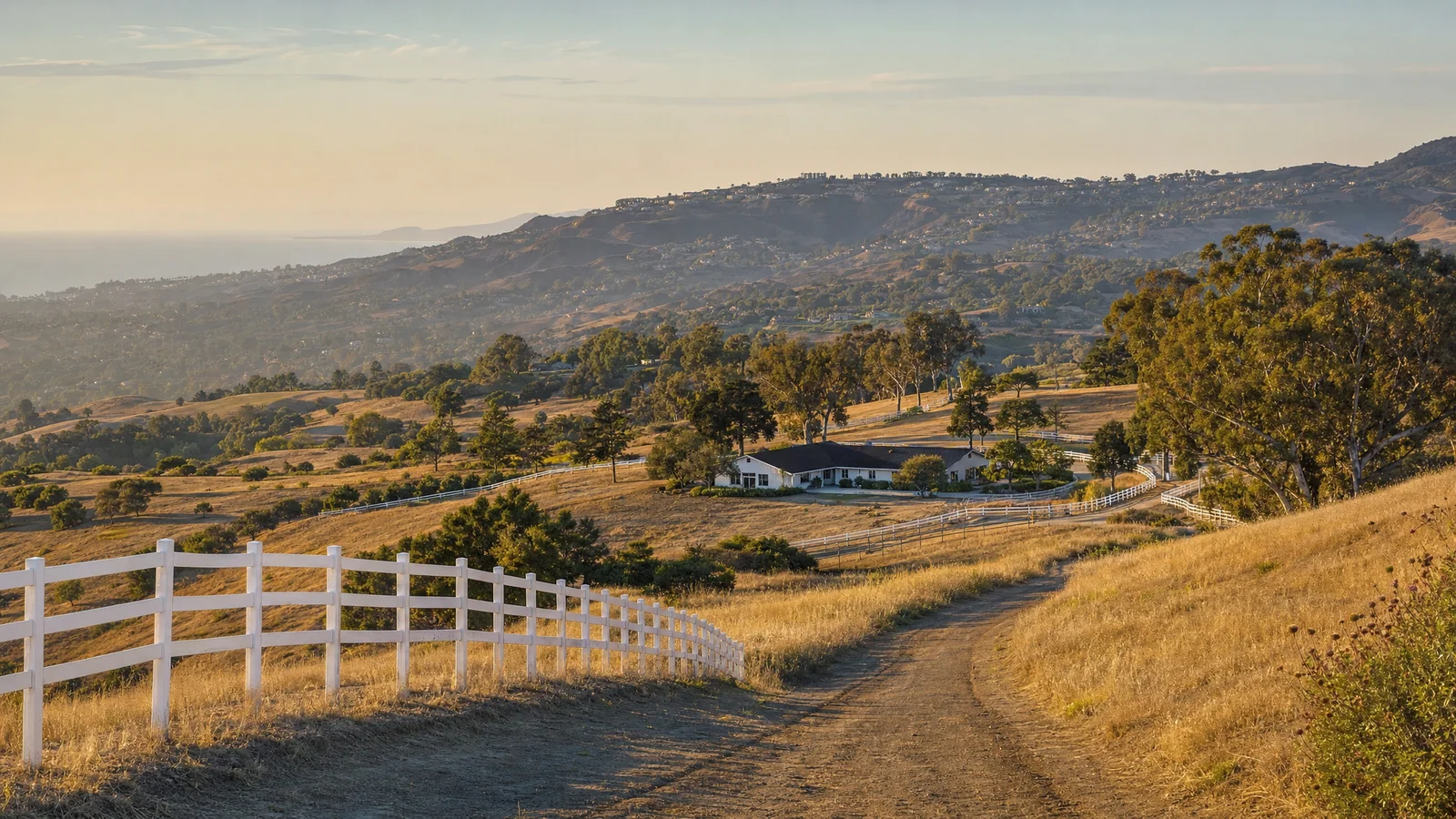 Building an ADU in Rolling Hills, CA — the open equestrian hillside and white ranch-style homes of the gated Palos Verdes Peninsula city, where CALI ADU permits single-story Signature Home ADUs under RHMC Chapter 17.28