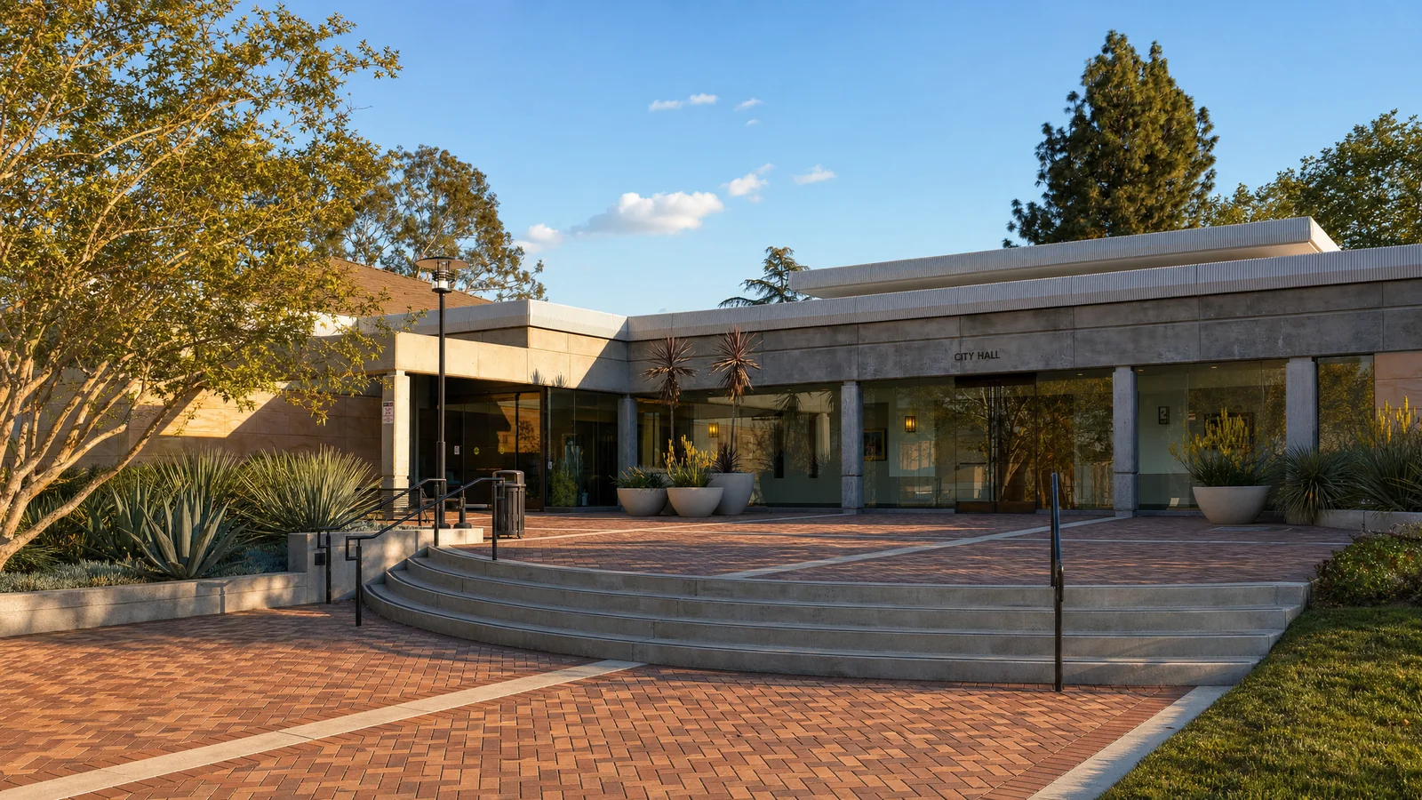 Building an ADU in San Dimas, CA — San Dimas City Hall across its brick-paver plaza in the eastern San Gabriel Valley, where CALI ADU designs and permits single-story Signature Home ADUs under SDMC Chapter 18.38