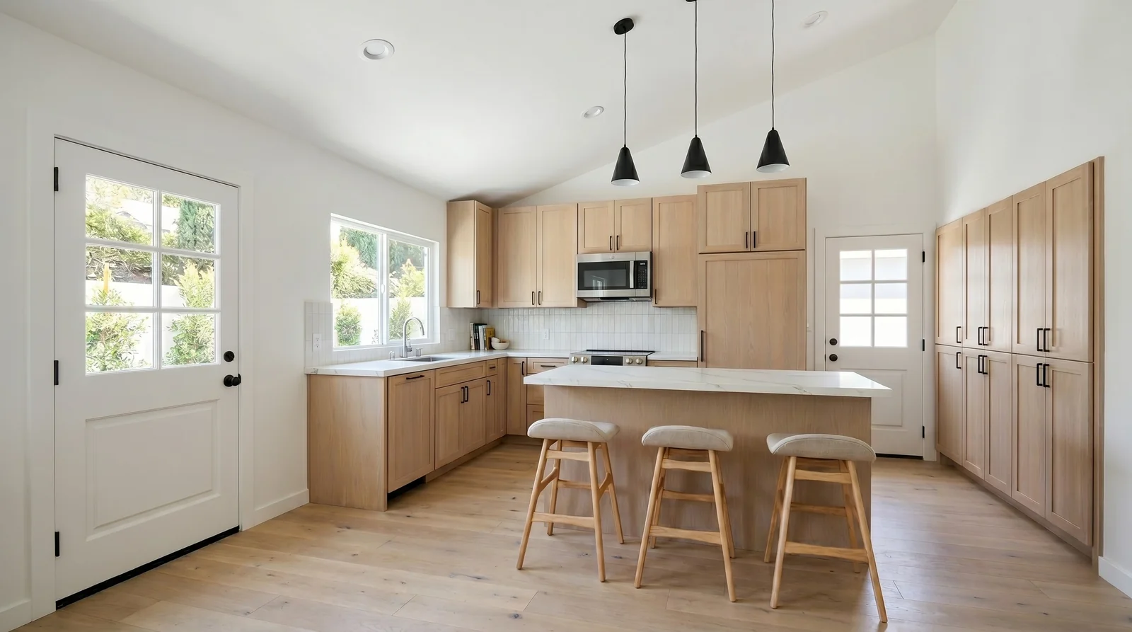 The Lincoln Signature Home interior — bright open kitchen inside a 1,000 sqft 3BR/2BA single-story ADU that fits Downey's 1,000-sqft detached cap for two-or-more-bedroom units under DMC § 9414.08(b)